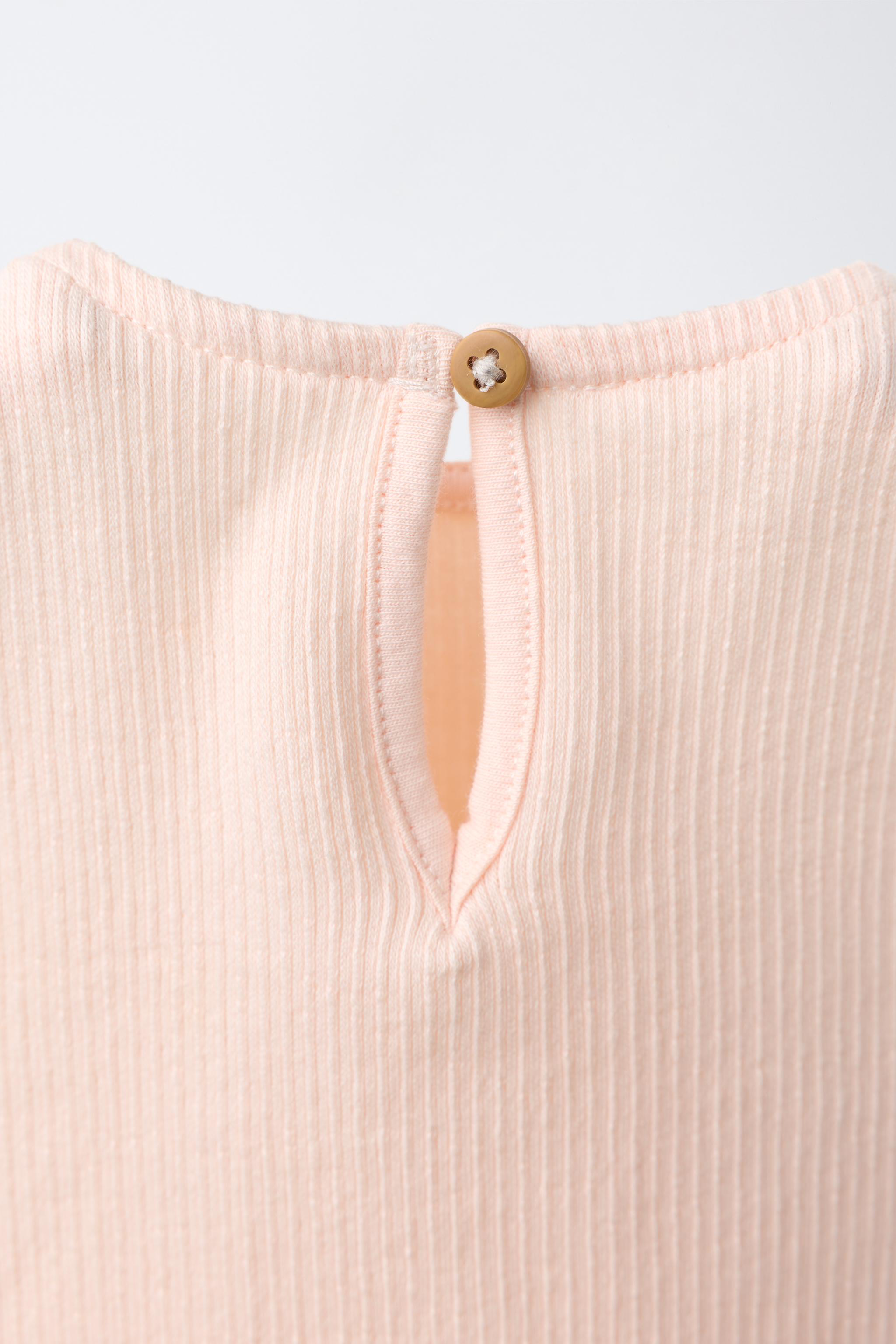 SUN EMBROIDERED RUFFLED BODYSUIT